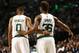 Feb 25, 2016; Boston, MA, USA; Boston Celtics guard Avery Bradley (0) and guard Marcus Smart (36) speak during the first half of a game against the Milwaukee Bucks at TD Garden. Mandatory Credit: Mark L. Baer-USA TODAY Sports