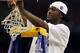 HOUSTON, TX - APRIL 04: Kemba Walker #15 of the Connecticut Huskies cuts down the net after defeating the Butler Bulldogs to win the National Championship Game of the 2011 NCAA Division I Men's Basketball Tournament by a score of 53-41 at Reliant Stadium
