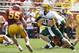 AMES, IA - AUGUST 30: quarterback Carson Wentz #11 of the North Dakota State Bison scrambles under pressure from linebacker Jevohn Miller #55 of the Iowa State Cyclones in the second half of play at Jack Trice Stadium on August 30, 2014 in Ames, Iowa. Nor