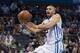 Mar 16, 2016; Charlotte, NC, USA; Charlotte Hornets forward Nicolas Batum (5) goes up for a shot in the second half against the Orlando Magic at Time Warner Cable Arena. The Hornets defeated the Magic 107-99. Mandatory Credit: Jeremy Brevard-USA TODAY Spo