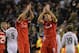 Liverpool's English midfielder Steven Gerrard (CR) and Liverpool's Croatian defender Dejan Lovren (CL) applaud the crowd after the final whistle in the UEFA Champions League, group B, football match between Liverpool and Real Madrid at Anfield in Liverpoo