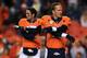 Osweiler (left) and Manning.