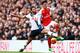 LONDON, ENGLAND - MARCH 05: Mesut Ozil of Arsenal and Mousa Dembele of Tottenham Hotspur compete for the ball during the Barclays Premier League match between Tottenham Hotspur and Arsenal at White Hart Lane on March 5, 2016 in London, England. (Photo b