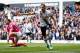 Kane celebrates the first of two goals against Bournemouth. A later shot would also lead to Christian Eriksen scoring Spurs' third.