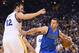 March 25, 2016; Oakland, CA, USA; Dallas Mavericks guard J.J. Barea (5) dribbles the basketball against Golden State Warriors center Andrew Bogut (12) during the first quarter at Oracle Arena. Mandatory Credit: Kyle Terada-USA TODAY Sports