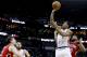 NEW ORLEANS, LA - MARCH 26: DeMar DeRozan #10 of the Toronto Raptors shoots over Omer Asik #3 of the New Orleans Pelicans during the second half of a game at the Smoothie King Center on March 26, 2016 in New Orleans, Louisiana. The Raptors won 115-91. NOT