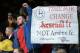An anti-Arsene Wenger banner is displayed by the Arsenal fans after the English Premier League football match between Everton and Arsenal at Goodison Park in Liverpool, north west England on March 19, 2016.
Arsenal won the game 2-0. / AFP / OLI SCARFF /