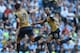 Arsenal's Chilean striker Alexis Sanchez (L) celebrates after scoring during the English Premier League football match between Manchester City and Arsenal at the Etihad Stadium in Manchester, north west England, on May 8, 2016. / AFP / PAUL ELLIS / RESTRI
