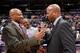 Brian Shaw greets Byron Scott during a Lakers/Nuggets game earlier this year.