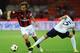 MILAN, ITALY - AUGUST 29: Andrea Pirlo of AC Milan is challenged by Simone Sini of US Lecce during the Serie A match between AC Milan and US Lecce at Stadio Giuseppe Meazza on August 29, 2010 in Milan, Italy. (Photo by Valerio Pennicino/Getty Images)
