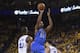 May 16, 2016; Oakland, CA, USA; Oklahoma City Thunder forward Kevin Durant (35) shoots the basketball against Golden State Warriors forward Harrison Barnes (40) during the fourth quarter in game one of the Western conference finals of the NBA Playoffs at