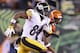 CINCINNATI, OH - JANUARY 09: Antonio Brown #84 of the Pittsburgh Steelers runs with the ball in the second half against the Cincinnati Bengals during the AFC Wild Card Playoff game at Paul Brown Stadium on January 9, 2016 in Cincinnati, Ohio. (Photo by