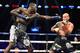 Deontay Wilder (L) of the US extends a left against Artur Szpilka of Poland during their WBC Heavyweight Championship bout at Barclay's Center in Brooklyn, New York, on January 16, 2016.
Wilder knocked out Szpilka in the ninth round. / AFP / AFP PHOTO /