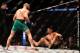 LAS VEGAS, NV - AUGUST 20: (L-R) Conor McGregor of Ireland knocks down Nate Diaz in their welterweight bout during the UFC 202 event at T-Mobile Arena on August 20, 2016 in Las Vegas, Nevada. (Photo by Jeff Bottari/Zuffa LLC/Zuffa LLC via Getty Images)