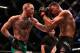 LAS VEGAS, NV - AUGUST 20: (L-R) Conor McGregor of Ireland punches Nate Diaz in their welterweight bout during the UFC 202 event at T-Mobile Arena on August 20, 2016 in Las Vegas, Nevada. (Photo by Jeff Bottari/Zuffa LLC/Zuffa LLC via Getty Images)