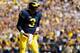 ANN ARBOR, MI - SEPTEMBER 03: Wilton Speight #3 of the Michigan Wolverines celebrates a first quarter touchdown pass to Grant Perry #9 while playing the Hawaii Warriors on September 3, 2016 at Michigan Stadium in Ann Arbor, Michigan. (Photo by Gregory Sha