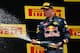Daniil Kvyat celebrates on the podium at the 2016 Chinese Grand Prix.