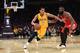 Jordan Clarkson drives on James Harden.