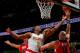 ATLANTA, GA - OCTOBER 27: Dwight Howard #8 of the Atlanta Hawks battles for a rebound against Otto Porter Jr. #22 and Marcin Gortat #13 of the Washington Wizards at Philips Arena on October 27, 2016 in Atlanta, Georgia. NOTE TO USER User expressly ackno