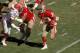 ATLANTA, GA - DECEMBER 3: Running back Roger Craig #33 of the San Francisco 49ers runs upfield behind the block of guard Bubba Paris #77 against the defensive end Ben Thomas #72 of the Atlanta Falcons in an NFL game at the Fulton County Stadium on Decemb