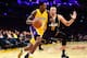 LOS ANGELES, CA - DECEMBER 05: Louis Williams #23 of the Los Angeles Lakers dribbles against Dante Exum #11 of the Utah Jazz during the first half at Staples Center on December 5, 2016 in Los Angeles, California. NOTE TO USER: User expressly acknowledge