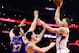 LOS ANGELES, CA - DECEMBER 07: Blake Griffin #32 of the LA Clippers shoots over Zaza Pachulia #27 and Klay Thompson #11 of the Golden State Warriors during a 115-98 Warriors win at Staples Center on December 7, 2016 in Los Angeles, California. NOTE TO U