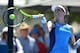 Johanna Konta of Britain hits a return to Arina Rodionova of Australia during their women's singles first round match at the Sydney International tennis tournament in Sydney on January 9, 2017. / AFP / PETER PARKS / IMAGE RESTRICTED TO EDITORIAL USE - STR