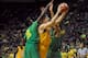 EUGENE, OR - NOVEMBER 17: Alec Peters #25 of the Valparaiso Crusaders drives to the basket on Chris Boucher #25 and Keith Smith #11 of the Oregon Ducks in the second half of the game at Matthew Knight Arena on November 17, 2016 in Eugene, Oregon. Oregon