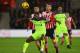 SOUTHAMPTON, ENGLAND - JANUARY 11: Georginio Wijnaldum of Liverpool holds off Steven Davis of Southampton during the EFL Cup semi-final first leg match between Southampton and Liverpool at St Mary's Stadium on January 11, 2017 in Southampton, England. (