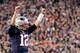 FOXBORO, MA - NOVEMBER 13: Tom Brady #12 of the New England Patriots reacts after handing off the ball for a touchdown during the first quarter of a game against the Seattle Seahawks at Gillette Stadium on November 13, 2016 in Foxboro, Massachusetts. (P