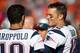CLEVELAND, OH - OCTOBER 9: Quarterbacks Jimmy Garoppolo #10 and Tom Brady #12 of the New England Patriots talk on the sidelines during the final minutes of the second half against the Cleveland Browns at FirstEnergy Stadium on October 9, 2016 in Cleveland