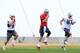 TEMPE, AZ - JANUARY 29: Julian Edelman #11,Tom Brady #12 and Rob Gronkowski #87 of the New England Patriots warm up during the New England Patriots Super Bowl XLIX Practice on January 29, 2015 at the Arizona Cardinals Practice Facility in Tempe, Arizona.