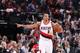 PORTLAND, OR - DECEMBER 26: C.J. McCollum #3 of the Portland Trail Blazers controls the ball against the Toronto Raptors during the game on December 26, 2016 at the Moda Center in Portland, Oregon. NOTE TO USER: User expressly acknowledges and agrees tha