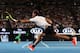 MELBOURNE, AUSTRALIA - JANUARY 29: Rafael Nadal of Spain plays a forehand in his Men's Final match against Roger Federer of Switzerland on day 14 of the 2017 Australian Open at Melbourne Park on January 29, 2017 in Melbourne, Australia. (Photo by Scott