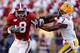 BATON ROUGE, LA - NOVEMBER 06: Julio Jones #8 of the Alabama Crimson Tide avoids a tackle by Patrick Peterson #7 of the Louisiana State University Tigers at Tiger Stadium on November 6, 2010 in Baton Rouge, Louisiana. The Tigers defeated the Crimson Tid