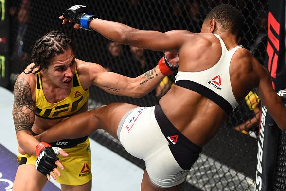 HOUSTON, TX - FEBRUARY 04: (R-L) Angela Hill kicks Jessica Andrade of Brazil in their women's strawweight bout during the UFC Fight Night event at the Toyota Center on February 4, 2017 in Houston, Texas. (Photo by Jeff Bottari/Zuffa LLC/Zuffa LLC via Get