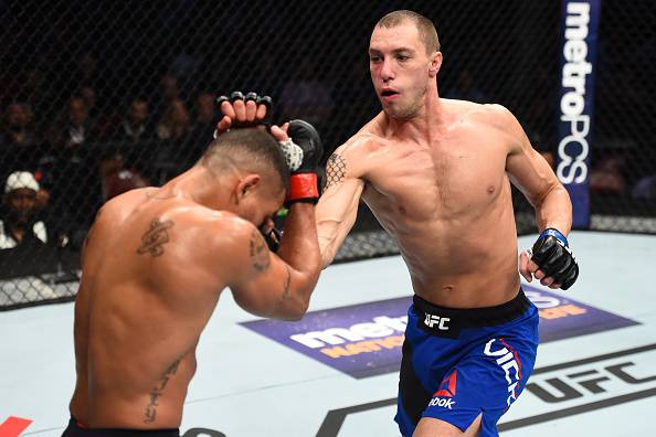 HOUSTON, TX - FEBRUARY 04: (R-L) James Vick punches Abel Trujillo in their lightweight bout during the UFC Fight Night event at the Toyota Center on February 4, 2017 in Houston, Texas. (Photo by Jeff Bottari/Zuffa LLC/Zuffa LLC via Getty Images)