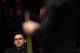England's Ronnie O'Sullivan (L) looks on as England's Joe Perry (R) plays at the table during the final of the Masters snooker tournament against at Alexandra Palace in London, on January 22, 2017. / AFP / Ben STANSALL (Photo credit should read BEN