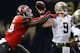 NEW ORLEANS, LA - SEPTEMBER 20: Drew Brees #9 of the New Orleans Saints is hit by Jacquies Smith #56 of the Tampa Bay Buccaneers during the first quarter of a game at the Mercedes-Benz Superdome on September 20, 2015 in New Orleans, Louisiana. (Photo by