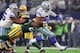 ARLINGTON, TX - JANUARY 15: Ezekiel Elliott #21 of the Dallas Cowboys carries the ball during the fourth quarter against the Green Bay Packers in the NFC Divisional Playoff game at AT&T Stadium on January 15, 2017 in Arlington, Texas. (Photo by Tom Penn