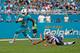 MIAMI GARDENS, FL - JANUARY 1: Jay Ajayi #23 of the Miami Dolphins runs from the attempted tackle by Rob Ninkovich #50 of the New England Patriots on January 1, 2017 at Hard Rock Stadium in Miami Gardens, Florida. The Patriots defeated the Dolphins 35-14.