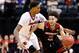 INDIANAPOLIS, IN - MARCH 17: Erik Durham #15 of the Jacksonville State Gamecocks dribbles against Ray Spalding #13 of the Louisville Cardinals during the first round of the 2017 NCAA Men's Basketball Tournament at Bankers Life Fieldhouse on March 17, 201