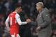 LONDON, ENGLAND - JANUARY 22: Mesut Ozil of Arsenal shakes hands with Arsene Wenger, Manager of Arsenal after substituted during the Premier League match between Arsenal and Burnley at the Emirates Stadium on January 22, 2017 in London, England. (Photo b