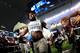 ARLINGTON, TX - NOVEMBER 24: Ezekiel Elliott #21 of the Dallas Cowboys celebrates with fans after the Dallas Cowboys beat the Washington Redskins 31-26 at AT&T Stadium on November 24, 2016 in Arlington, Texas. (Photo by Tom Pennington/Getty Images)