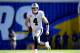 SAN DIEGO, CA - DECEMBER 18: Derek Carr #4 of the Oakland Raiders scrambles out of the pocket for a first down during the first quarter against the San Diego Chargers at Qualcomm Stadium on December 18, 2016 in San Diego, California. (Photo by Harry How