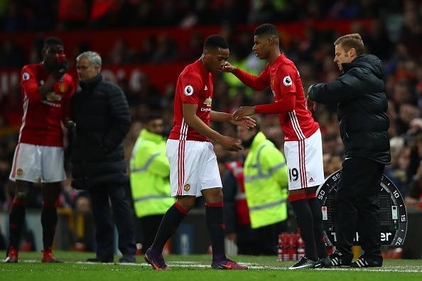 MANCHESTER, ENGLAND - DECEMBER 11: Marcus Rashford of Manchester United shakes hands with Anthony Martial during the Premier League match between Manchester United and Tottenham Hotspur at Old Trafford on December 11, 2016 in Manchester, England. (Photo