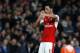 Arsenal's German midfielder Mesut Ozil celebrates after scoring the opening goal of the English Premier League football match between Arsenal and West Ham United at the Emirates Stadium in London on April 5, 2017. / AFP PHOTO / Ian KINGTON / RESTRICTED T
