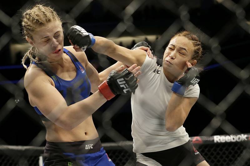 Waterson (right) punches VanZant