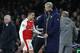 Arsenal's French manager Arsene Wenger (R) greets Arsenal's Chilean striker Alexis Sanchez after he is substituted during the UEFA Champions League last 16 second leg football match between Arsenal and Bayern Munich at The Emirates Stadium in London on Ma