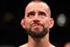 CLEVELAND, OH - SEPTEMBER 10: Phil 'CM Punk' Brooks stands in the Octagon after being defeated by Mickey Gall by submission in their welterweight bout during the UFC 203 event at Quicken Loans Arena on September 10, 2016 in Cleveland, Ohio. (Photo by Jos